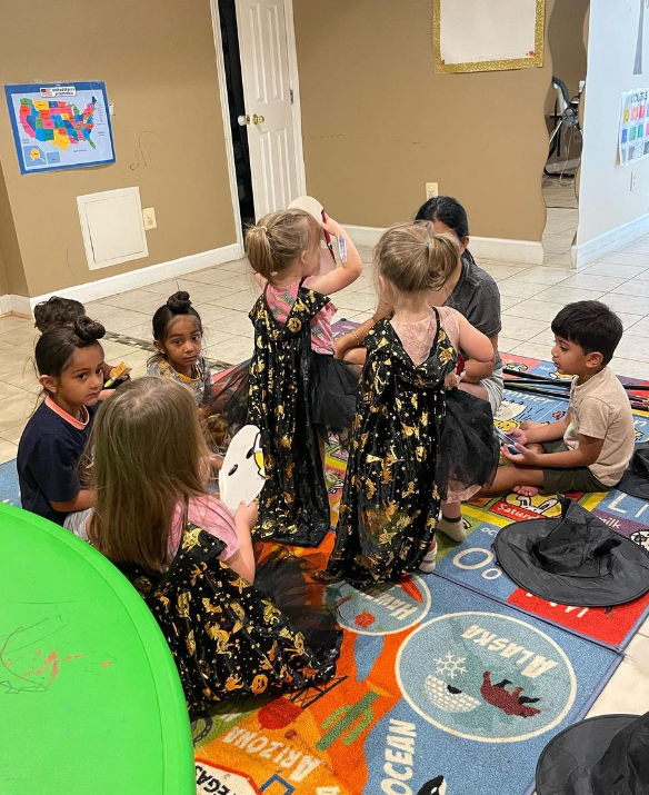 kids wearing costumes dancing