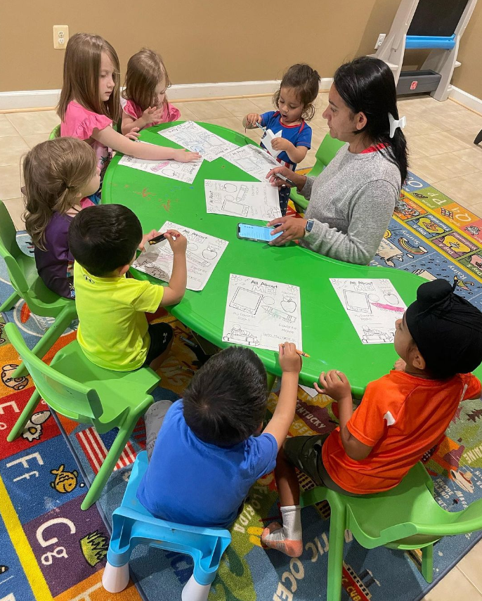 kids sitting at a table in class