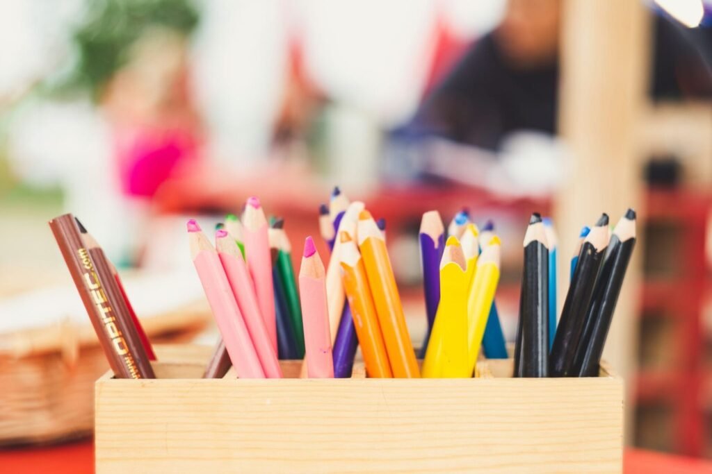 colored pencils in a bin