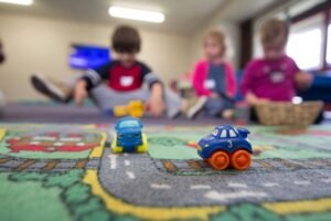 kids playing on city rug